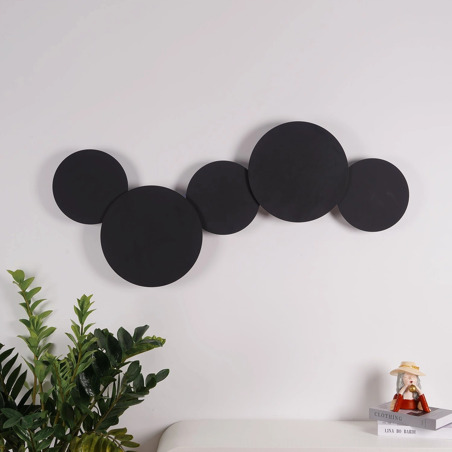 Modern disc wall lamp with interlocking circular discs designed for contemporary gallery and luxury residential spaces