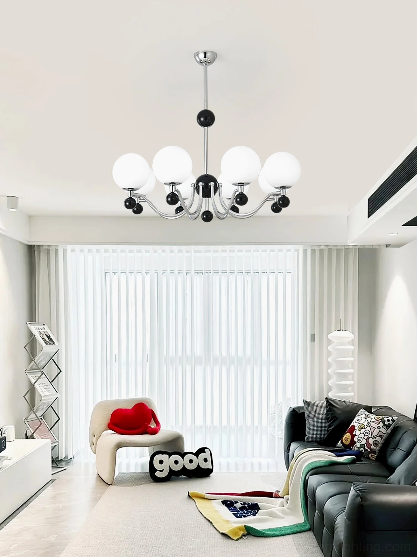 Multi-head spherical chandelier with chrome frame and black accent balls in modern minimalist living room