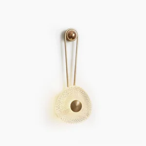 Modern geometric metal wall sconce with acrylic diffuser, studio view showcasing sculptural frame and warm lighting design