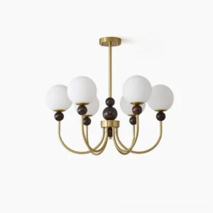Modern glass pendant chandelier with brass metal frame and frosted white spherical shades, front view on white background