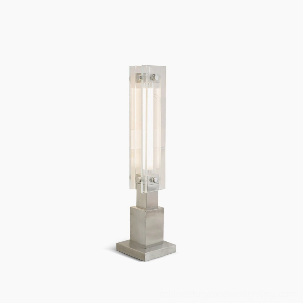Modern minimalist glass table lamp with chrome base, front studio view on white background