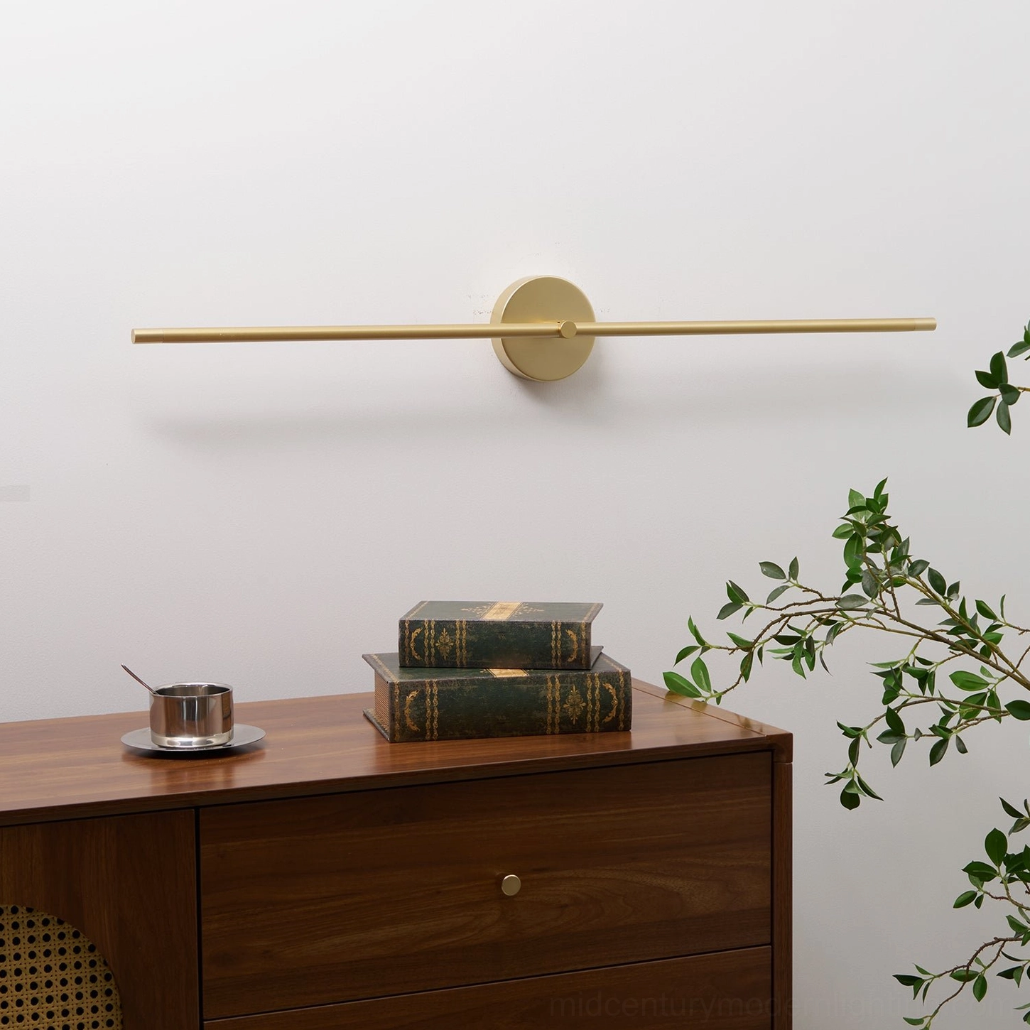 Modern linear wall lamp in gold finish creating architectural statement piece