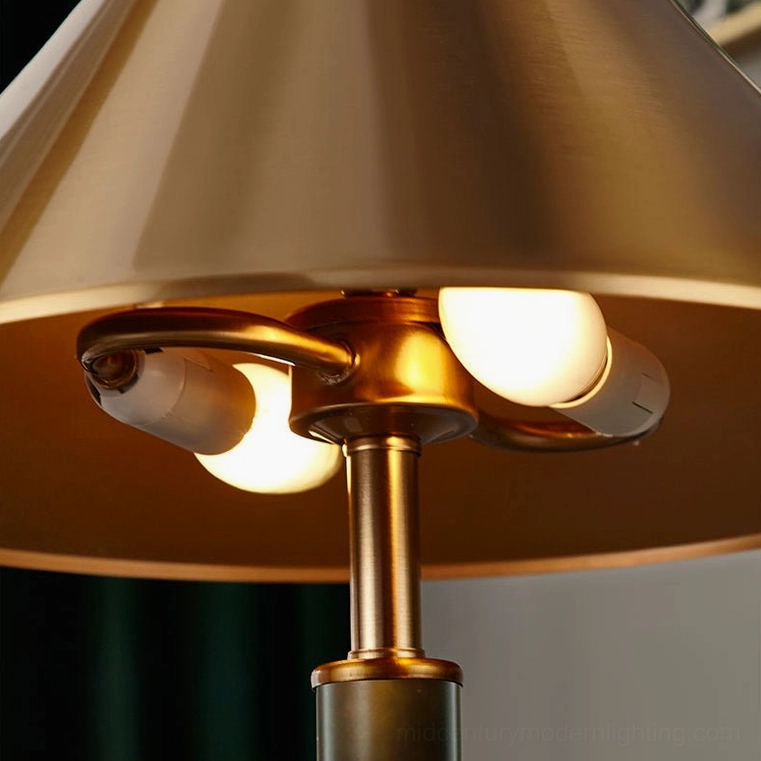Under-shade triple bulb setup, brushed brass finish interior lamp detail