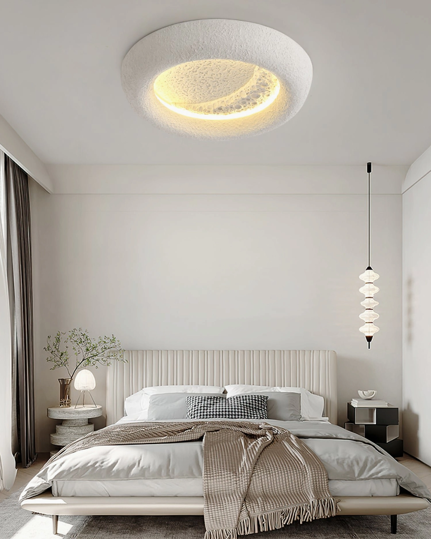Modern LED ceiling light with moon crater texture emitting warm white light in studio setting