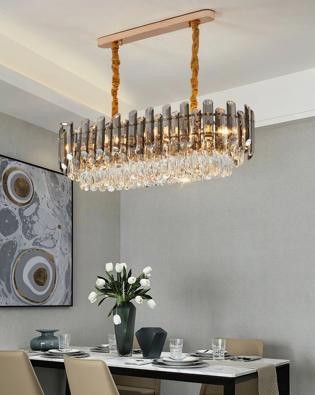 Linear rectangular crystal chandelier with clear crystal decor and gold hanging rods in contemporary dining space