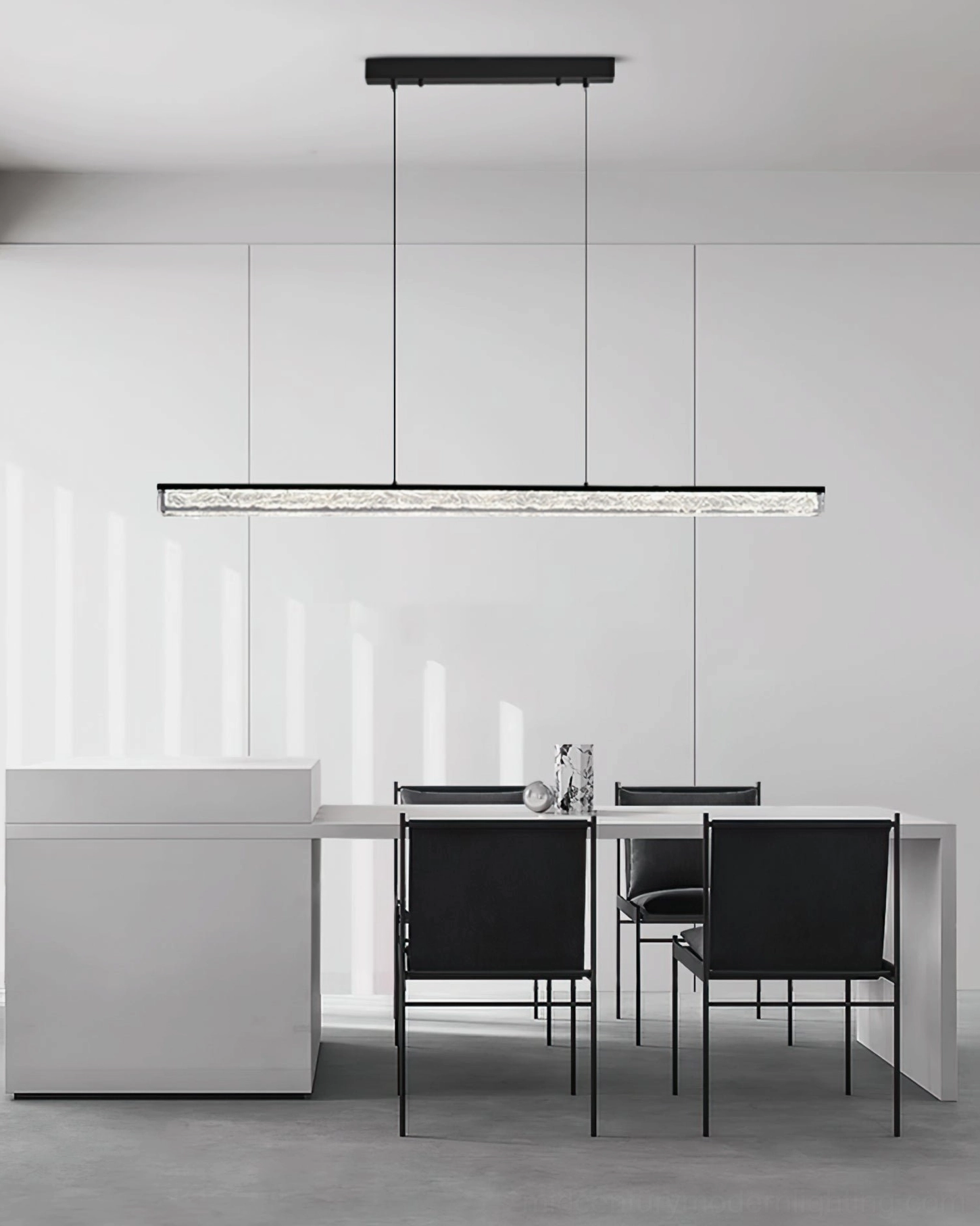Modern linear LED pendant suspended in clean white minimalist dining room with kitchen island