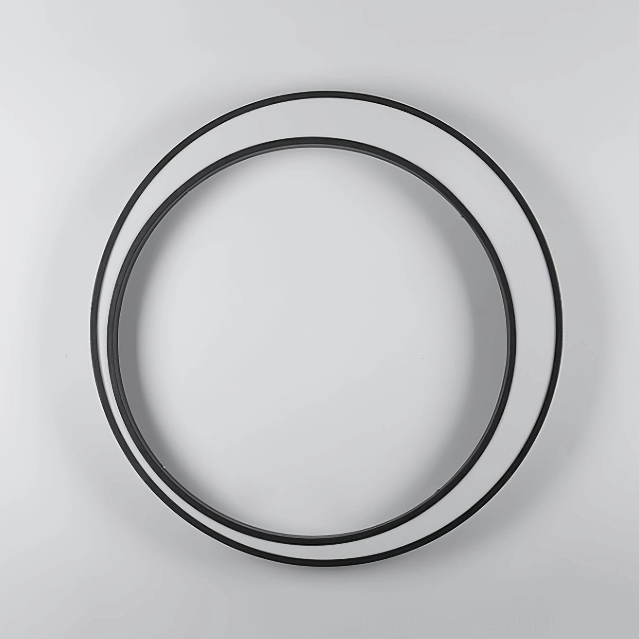 Modern minimalist outdoor wall lamp product photography showing sculptural circular form and refined aesthetics
