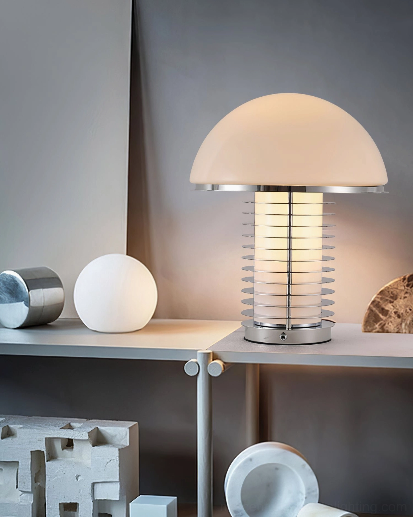 Mushroom table lamp with warm ambient glow surrounded by decorative ornaments on indoor shelf