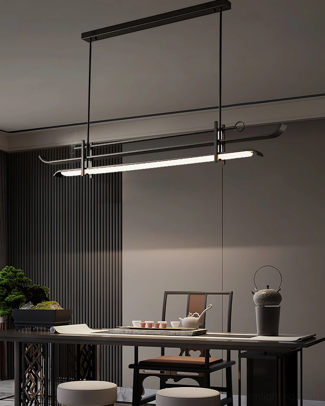 Architectural LED chandelier suspended in traditional Chinese inspired interior with dark wood furnishings and tea table