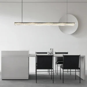Three-color adjustable LED pendant chandelier suspended above modern dining table in minimalist white interior