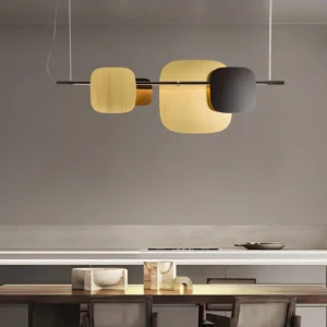 Contemporary rounded square pendant light hanging above modern dining table in luxury minimalist kitchen setting