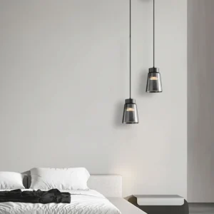 Pair of smoke grey cone pendant lamps in minimalist bedroom, eye-level bedroom lighting