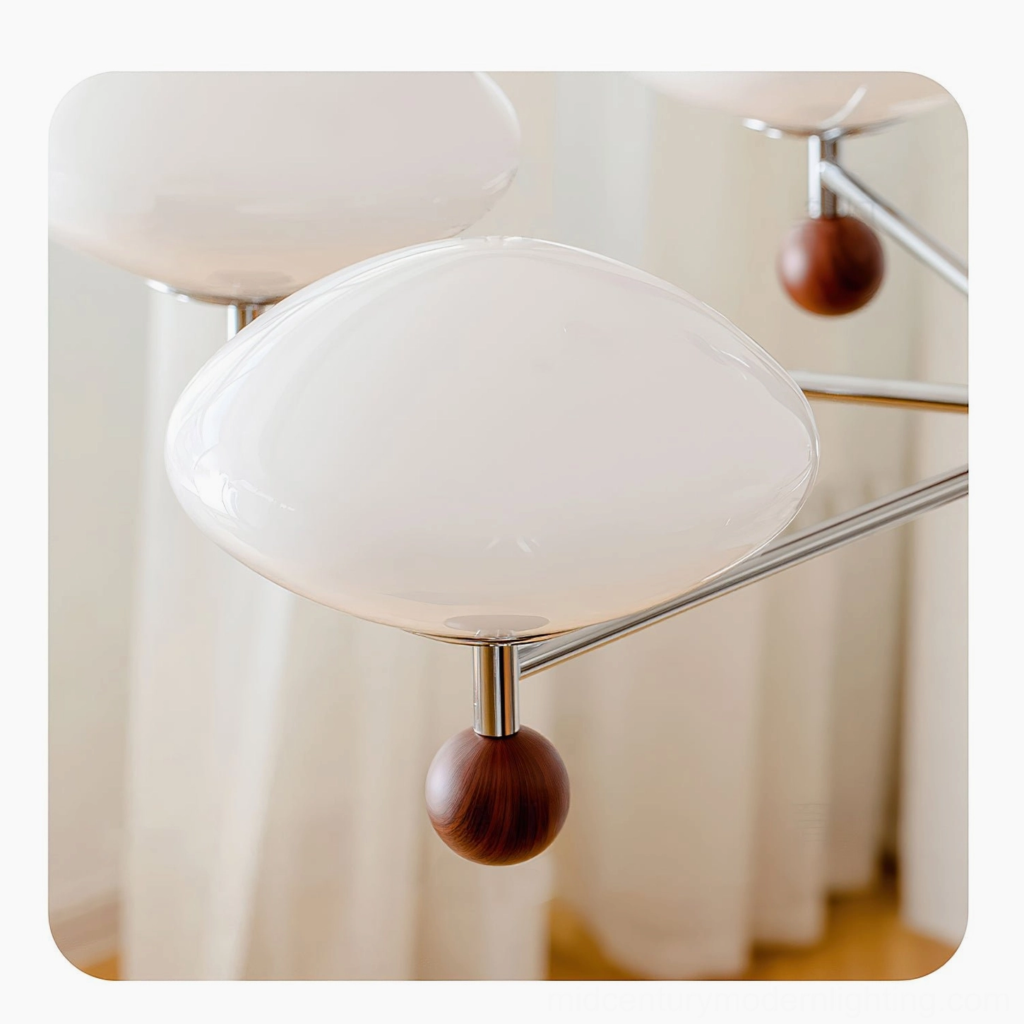 Modern pointed pendant chandelier professional photography - showcase image of chrome arms and frosted glass shades