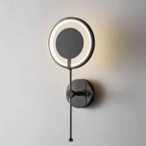Close-up of glowing LED ring wall lamp with warm white light diffusion and precision acrylic diffuser detail
