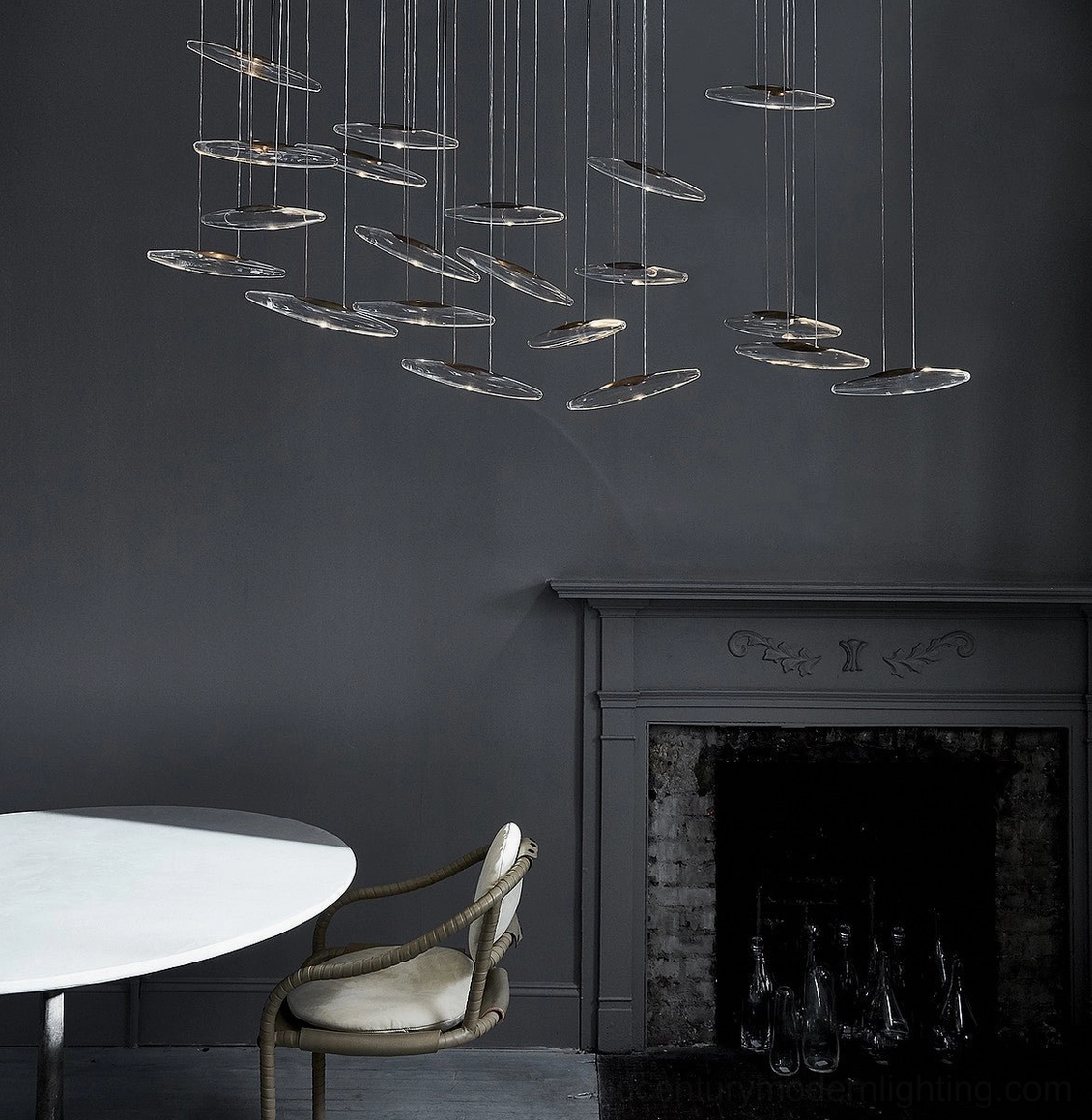 Modern spinning glass chandelier design with contemporary styling and warm ambient lighting