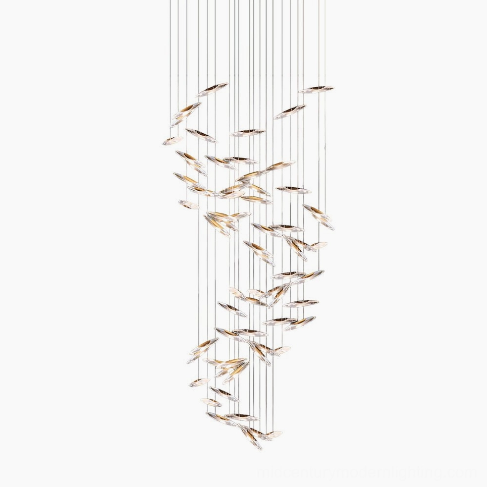 Modern spiral glass chandelier with cascading clear pendants and minimalist luxury design on white studio background