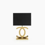 Polished stainless steel table lamp with dome shade, front studio view showcasing modern Nordic design and minimalist silhouette