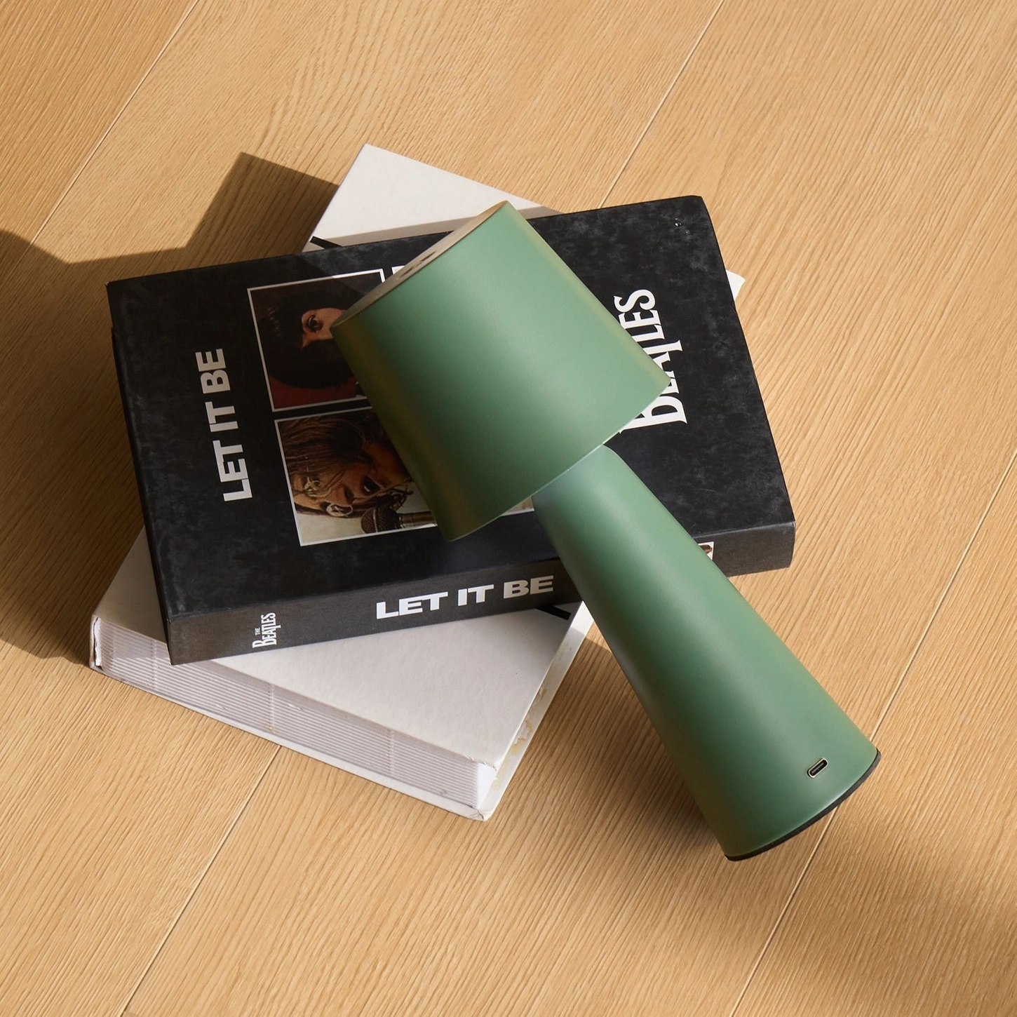 Modern rechargeable table lamp detail shot showing smooth matte finish and geometric design