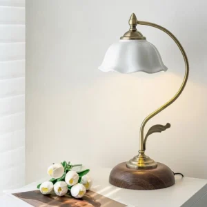 Mid-century modern table lamp styled on bedroom nightstand with tulip flowers and magazine, ambient lighting display