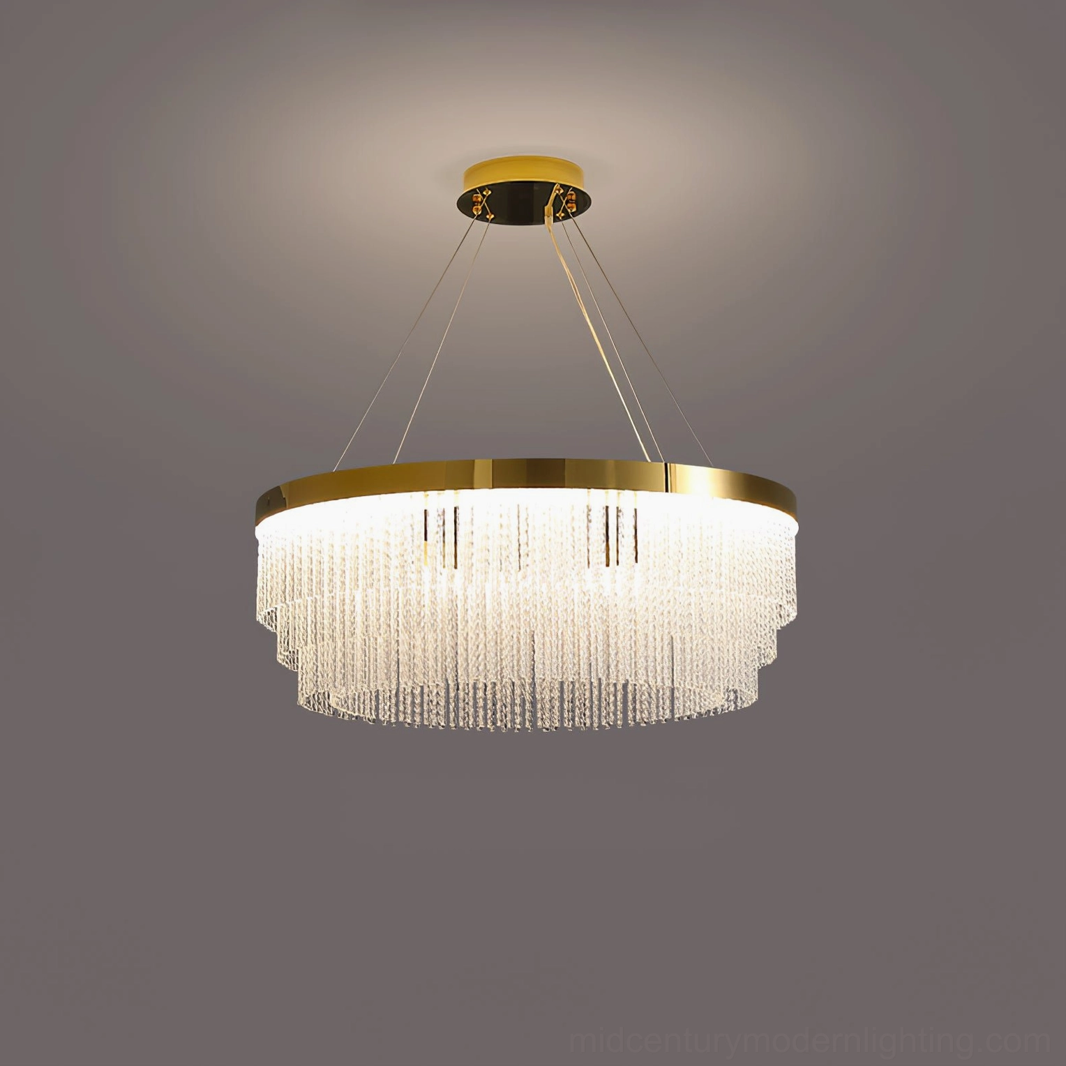 Tiered round crystal chandelier with warm glowing LED light and gold metal frame detail shot