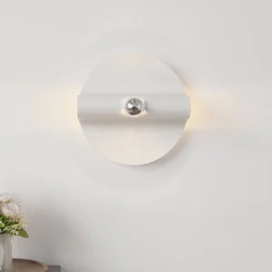 Single illuminated minimalist wall lamp with warm glow, white base and chrome fixture in interior setting
