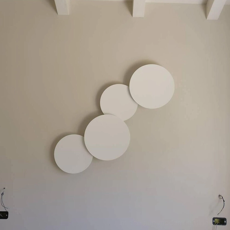 Modern geometric disc wall installation showing scalable modular system for various interior dimensions and configurations