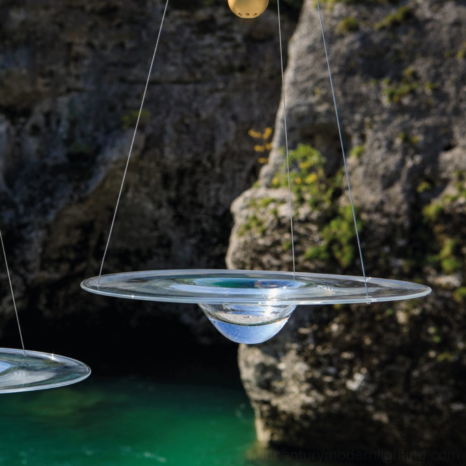 Momento pendant lamp low angle close-up showcasing translucent glass diffuser with integrated LED warm lighting