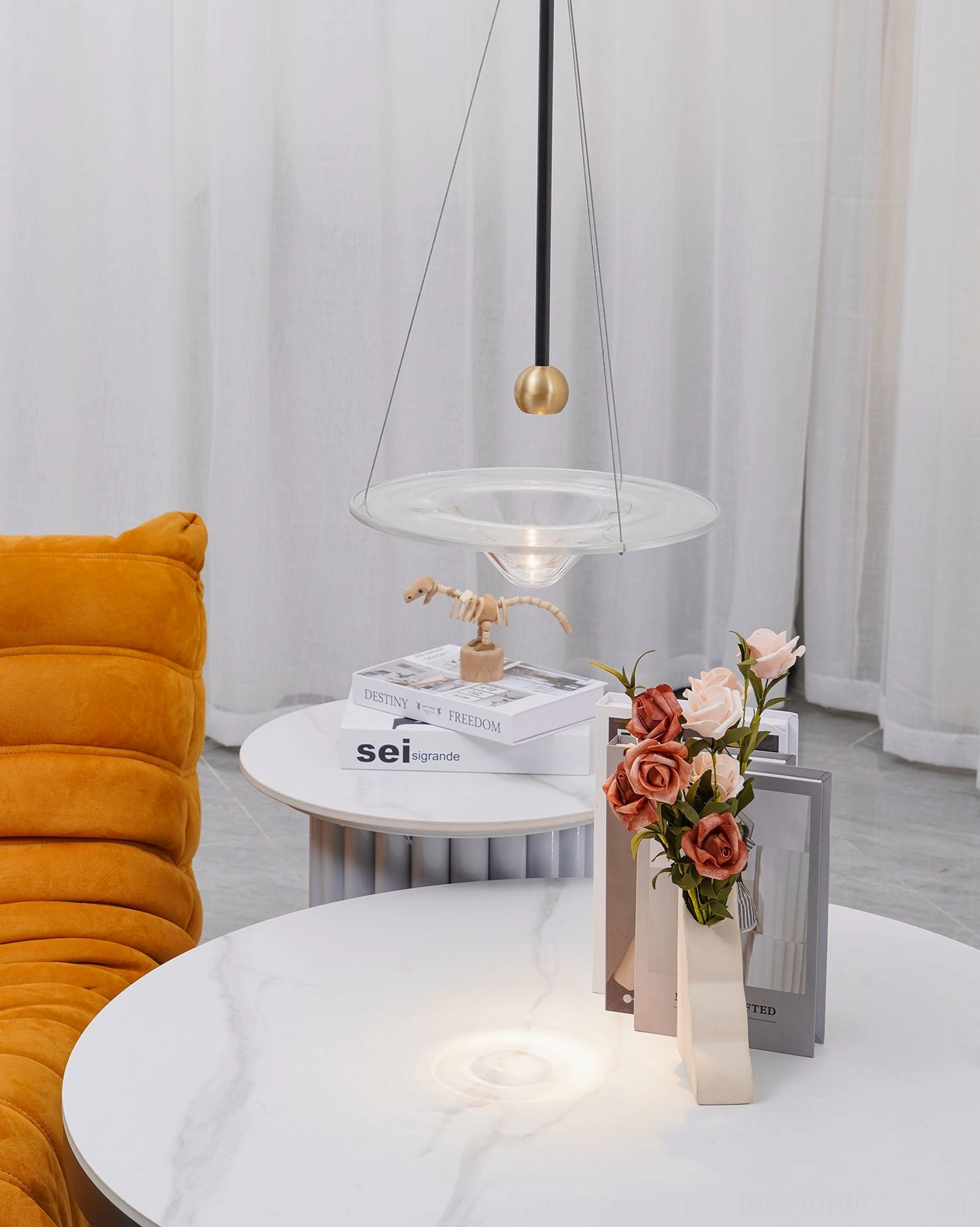 Momento pendant light fixture detail showing integrated LED technology and clear glass sphere construction