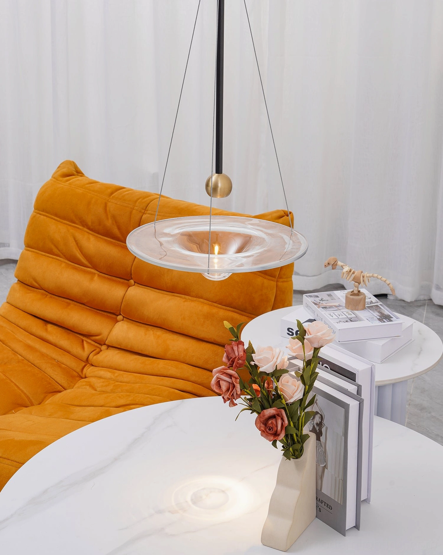 Momento pendant lamp installed ceiling mount showing suspension cable and metal frame connection