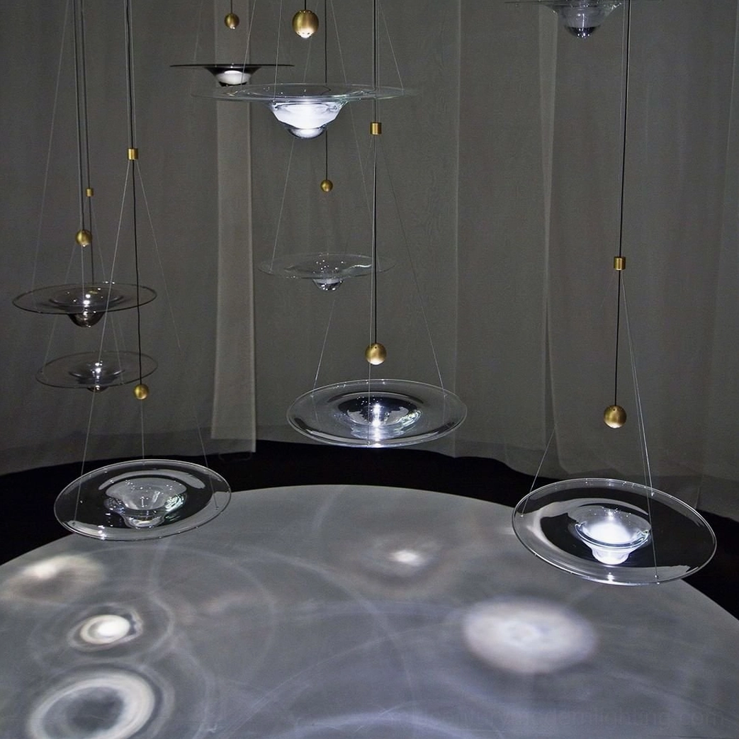 Momento glass pendant suspended in contemporary kitchen space with integrated LED warm lighting