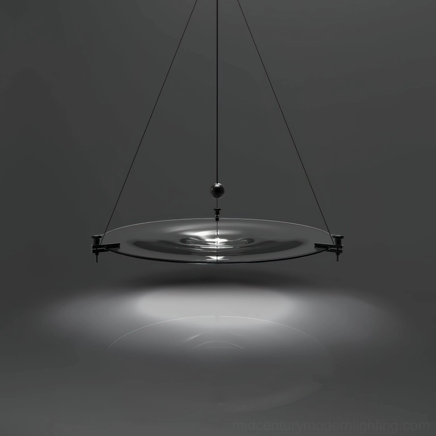 Momento pendant light warm illumination highlighting transparent glass material quality and clarity