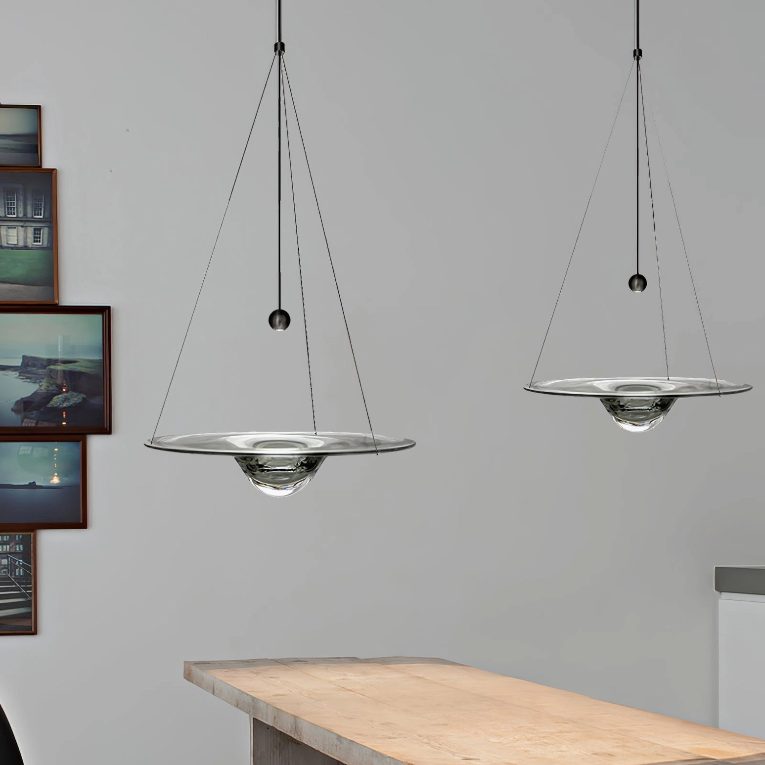 Momento pendant lamps multiple units creating sculptural arrangement with varying light temperatures
