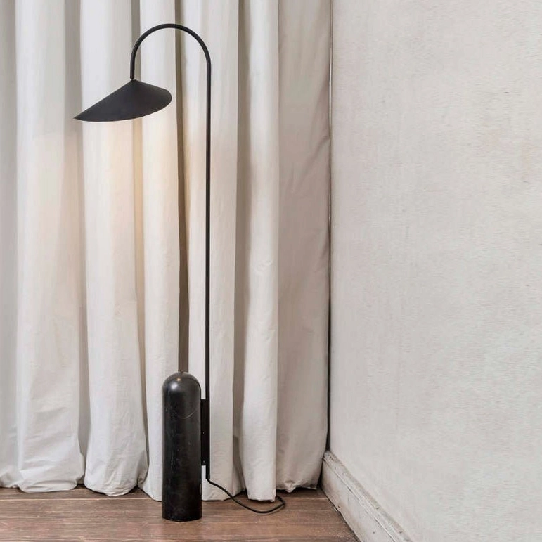 Mono floor lamp matte black metal arc with black marble stone base minimalist interior with curtains