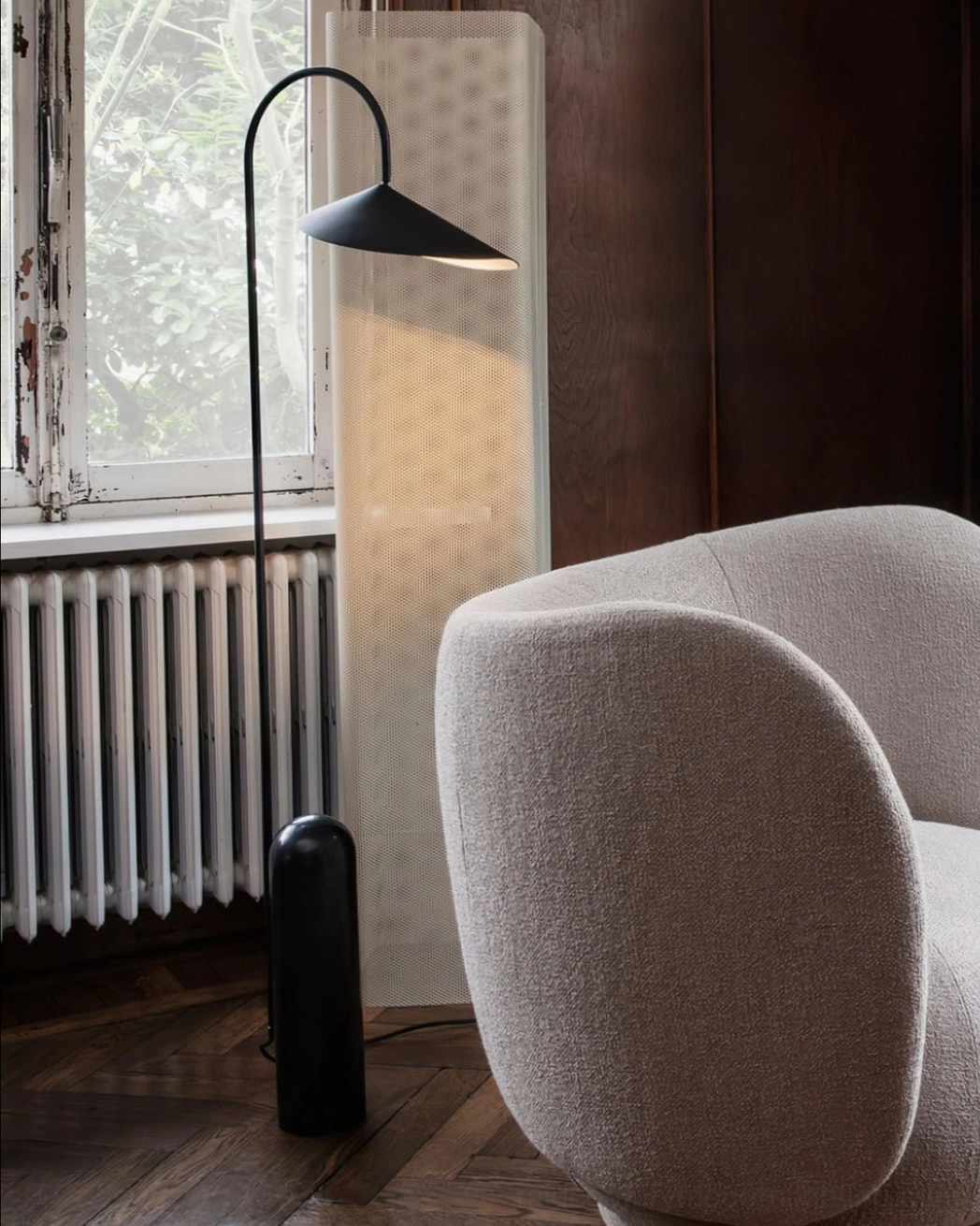 Mono floor lamp with conical shade design creating focused downward light pool