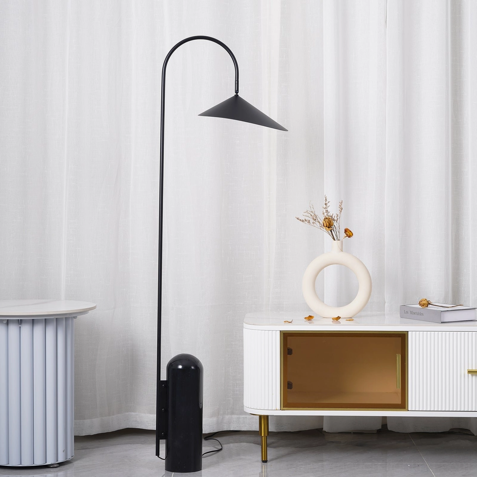 Mono floor lamp in contemporary space showing visual weight balance and proportional design