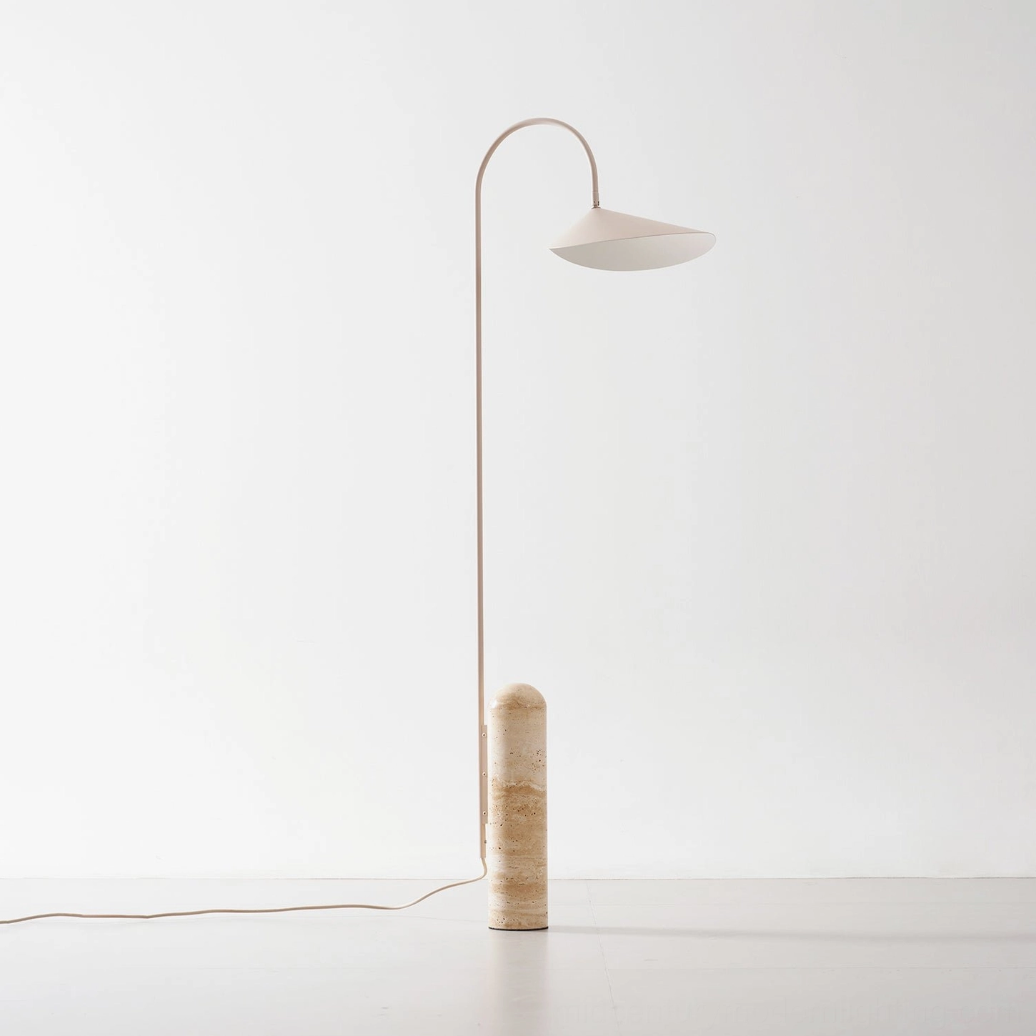 Mono floor lamp in corner placement directing light over seating area modern home setting