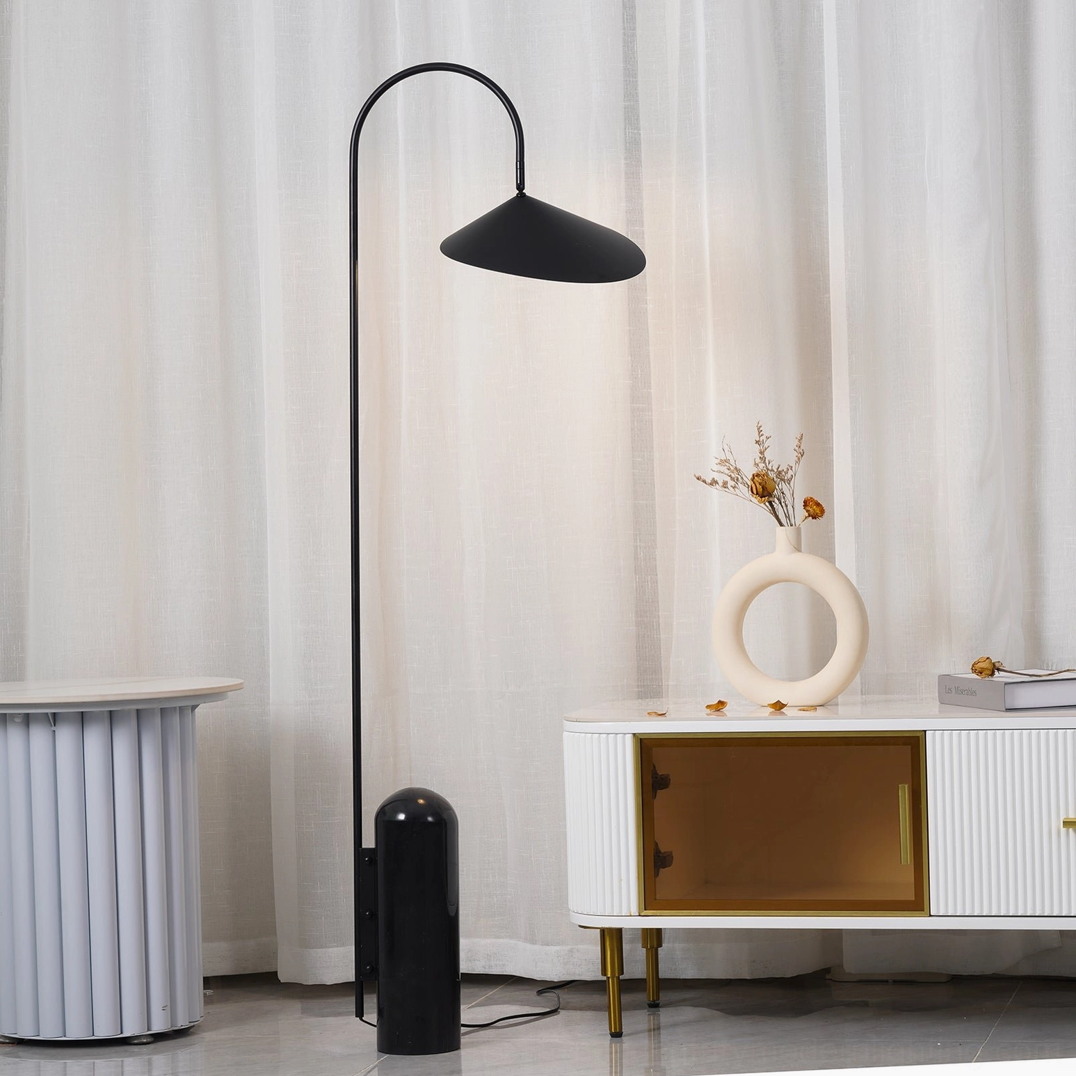 Mono floor lamp metal arm curve showing matte finish and conical shade engineering
