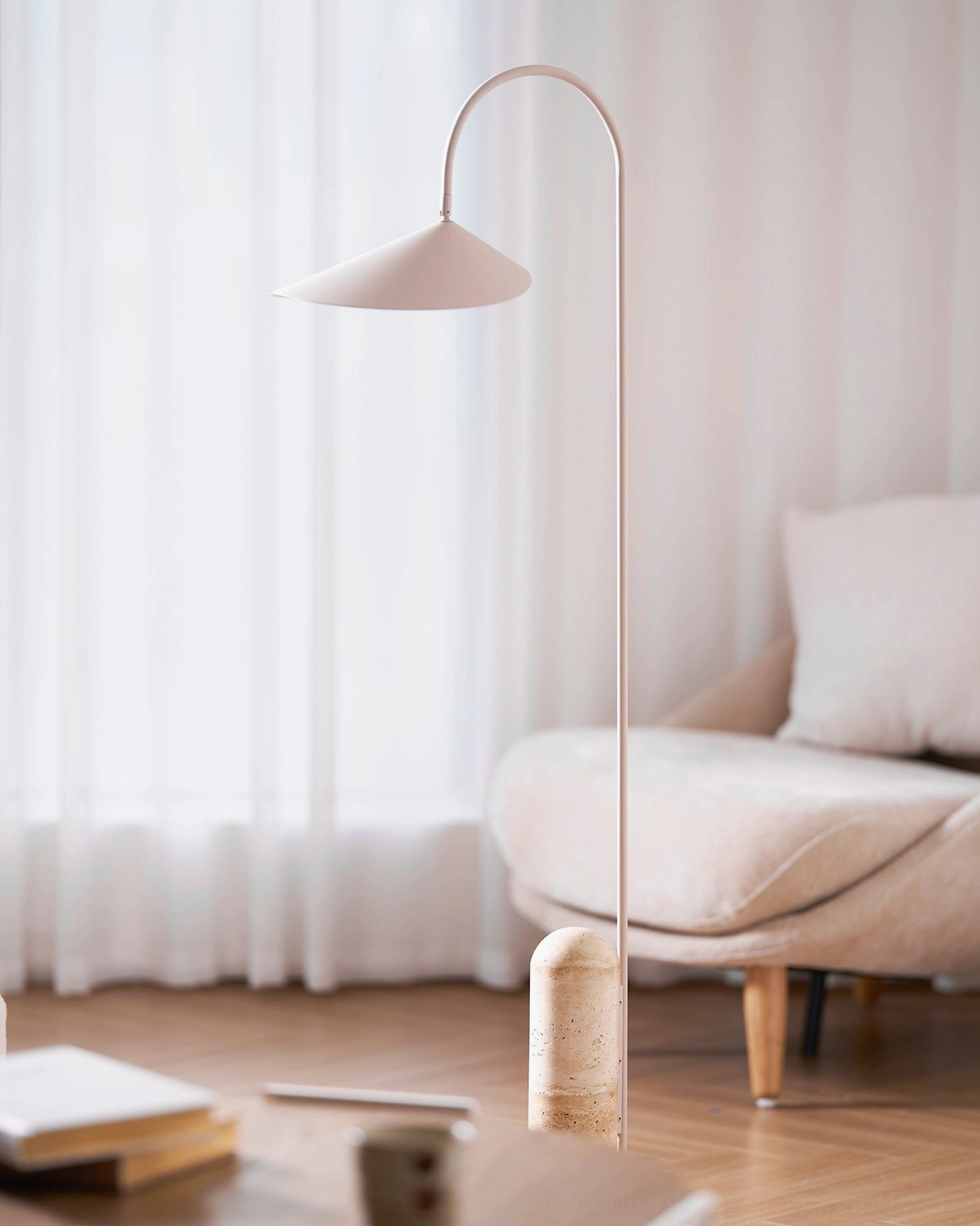 Mono floor lamp side profile showing elegant curved arm and base positioning for reading corner