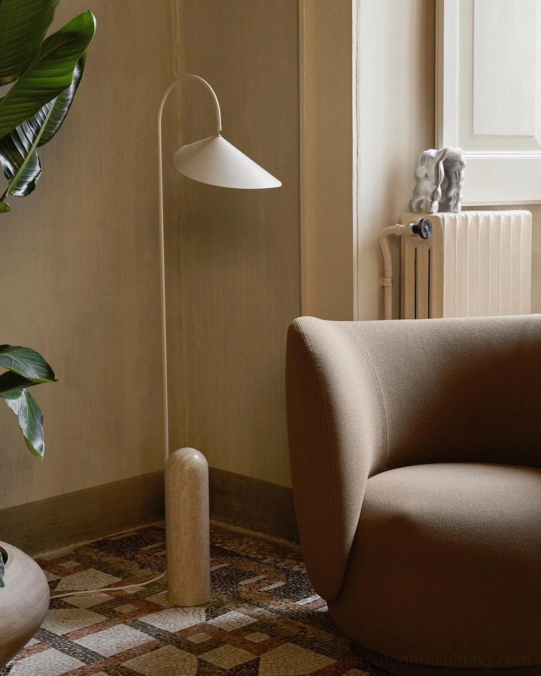 Mono floor lamp off-white finish curved arc metal arm with travertine stone base in vintage style room