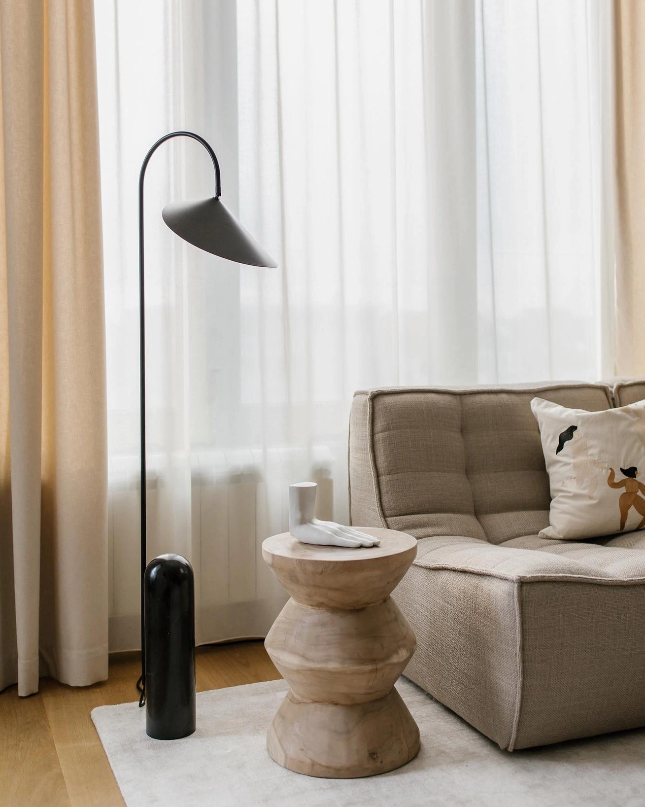 Mono floor lamp in contemporary minimalist room showing visual weight and balance