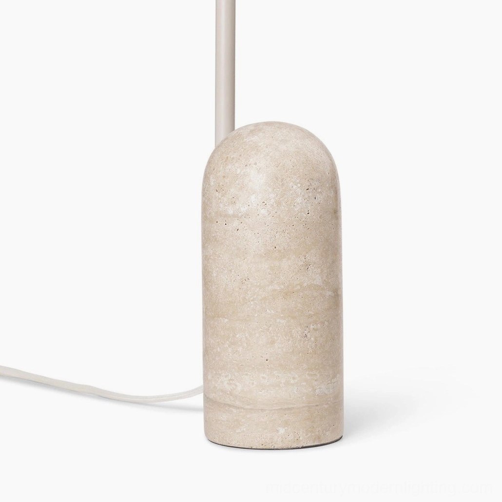 Minimalist black table lamp with graceful arc stem and natural cavestone marble support base