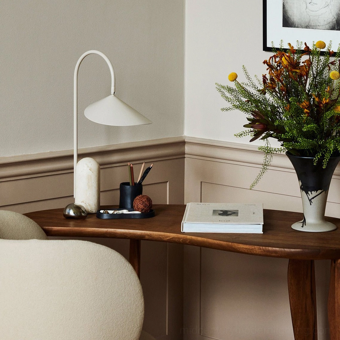 Black Mono marble lamp with sculptural metal stem and natural cavestone base detail view