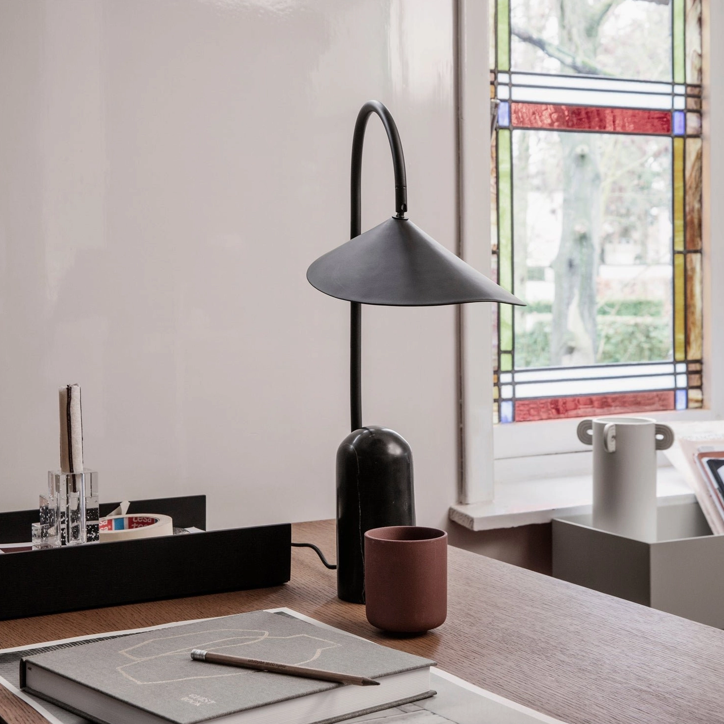 Mono table lamp base crafted from natural cavestone marble with unique geological texture