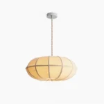 Montecito ribbed linen pendant light with architectural metal framework, frontal studio view showing geometric concentric rib pattern and oval silhouette