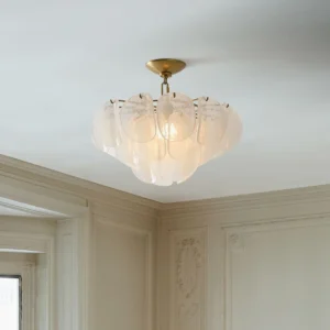 Montecito ceiling light fixture installed in residential room with warm illuminated glow creating soft ambient lighting from layered glass design