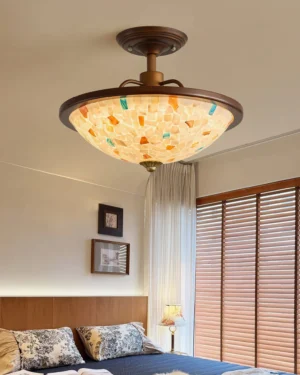 Monterey Capiz shell ceiling fixture installed in modern bedroom with warm ambient lighting and vintage-inspired decor