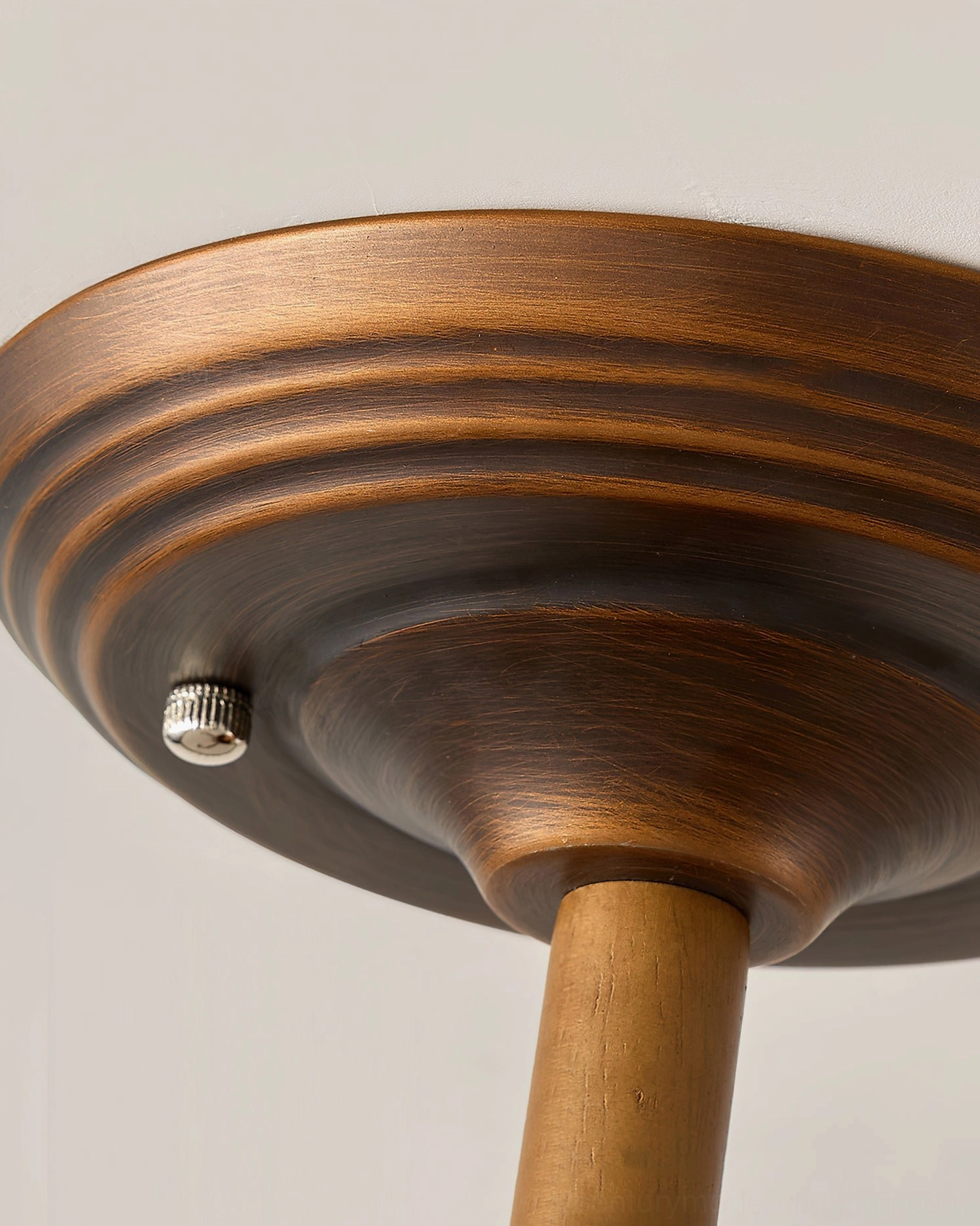Monterey Capiz light mounting base close-up showing vintage distressed walnut finish and metal bracket assembly