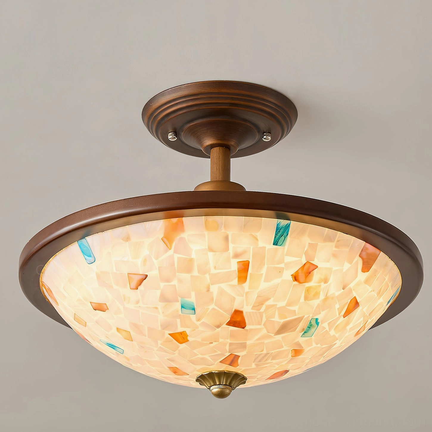 Monterey Capiz shell mosaic ceiling light low-angle front view showing intricate tile pattern and warm glow, white background