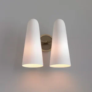 Two-head Montfaucon wall sconce pair with warm brass finish and dual frosted glass shades glowing ambient light