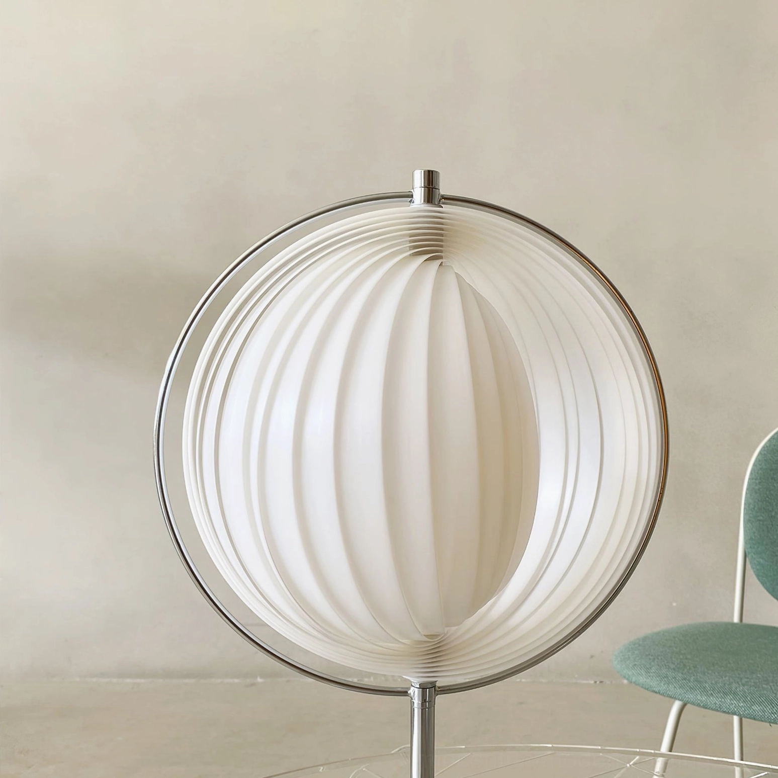 Moon Kare pleated globe lamp close-up detail of white ribbed shade and chrome metal frame structure